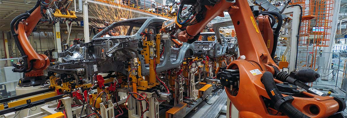 Robot arms in car assembly line